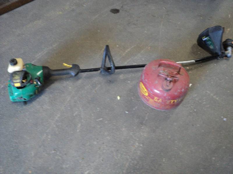 lot 74 image: weed whip and metal gas can...