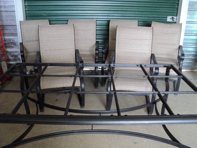 lot 141 image: New 7 piece patio set, 6 chairs and tab...