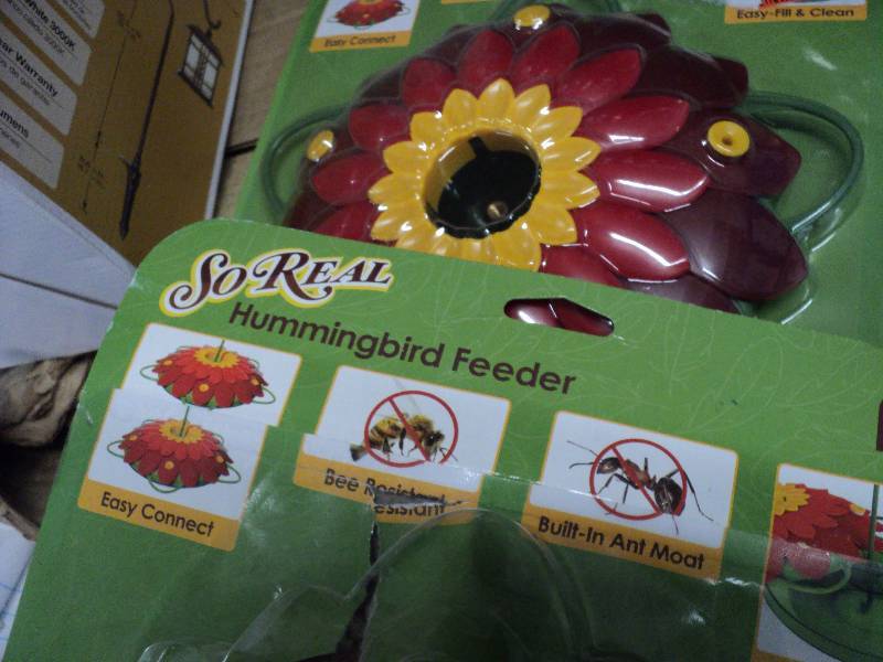 lot 165 image: 2 so-real hummingbird feeders, rela...