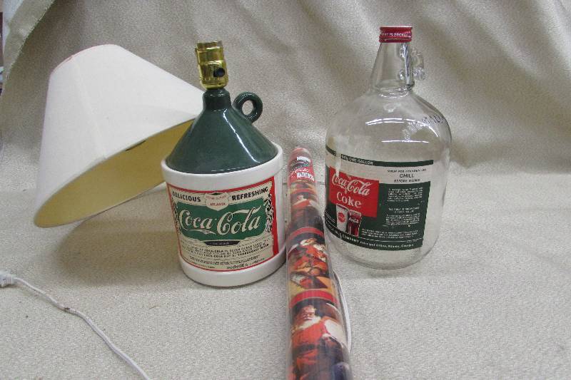 lot 135 image: COCA-COLA GALLON GLASS JUG, WRAPPING PAPER AND JUG LAMP
