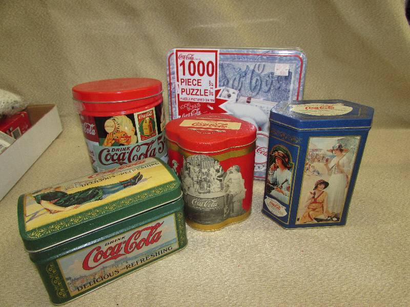 lot 142 image: COCA-COLA TINS AND PUZZLES