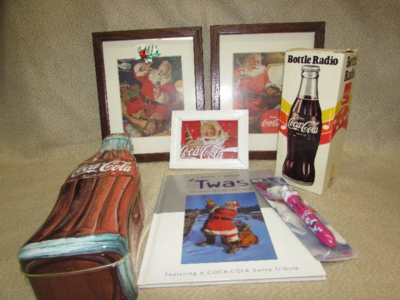 lot 153 image: COCA-COLA FRAMED MAGAZINE ADS, NESTING COCA-COLA TIN, BOTTLE RADIO - BROKEN, TWAS THE NIGHT BEFORE CHRISTMAS BOOK