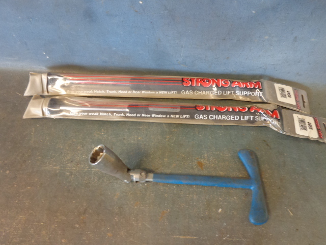 lot 130 image: Lift Supports and Spark Plug Remover