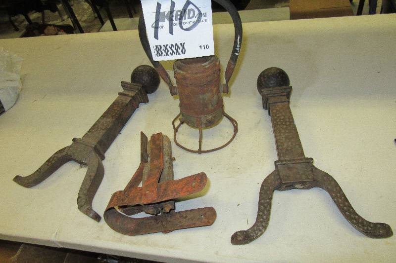 lot 110 image: 2 Fireplace Andirons, antique lantern, Hardware for the end of a wagon tow center pole