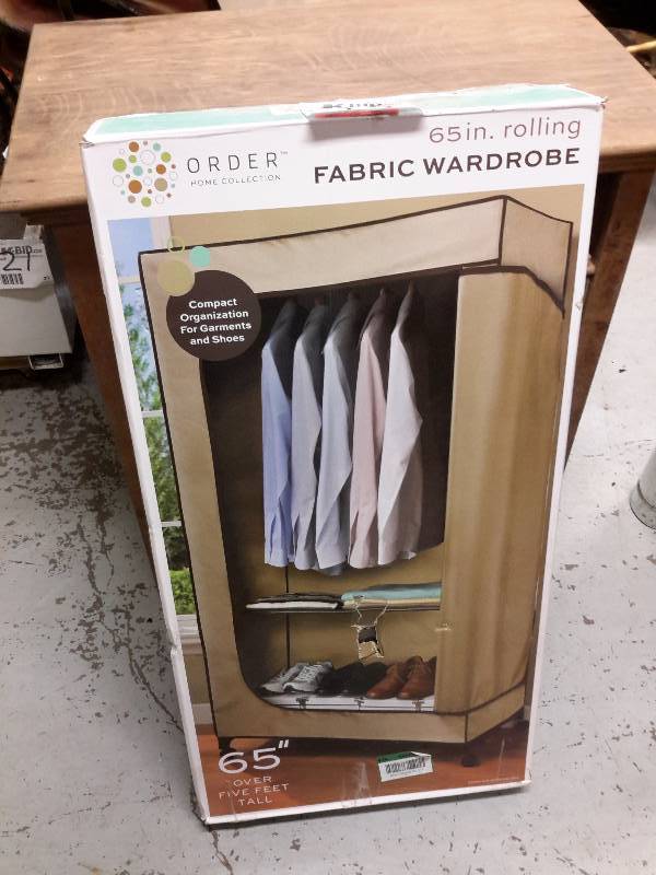 lot 22 image: 65 in Rolling Fabric Wardrobe