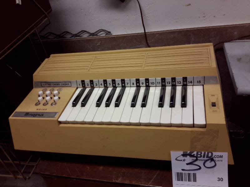 lot 30 image: Magnus, Electric Cord Organ..