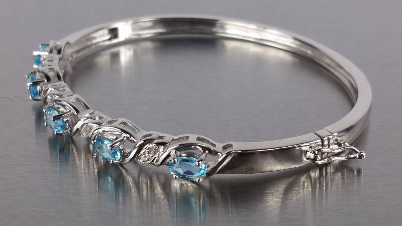 lot 61 image: Blue Topaz and Diamond Bracelet