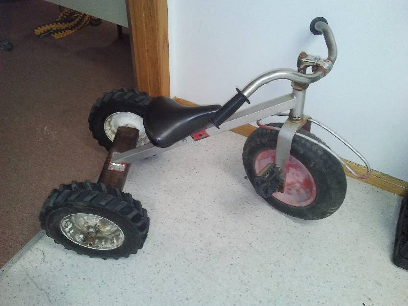 lot 10 image: Tricycle  Handcrafted One of a Kind Front tire 14-inch diameter and rear tires are 12-inch diameter