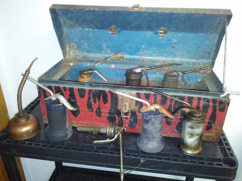 lot 106 image: Metal tool box with variety of oil cans (7)