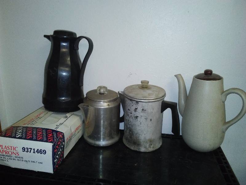 lot 120 image: Vintage Coffee Pots (4) two aluminum stove  camping pots, ceramic carafe and thermos carafe and nearly full box plastic disposable aprons