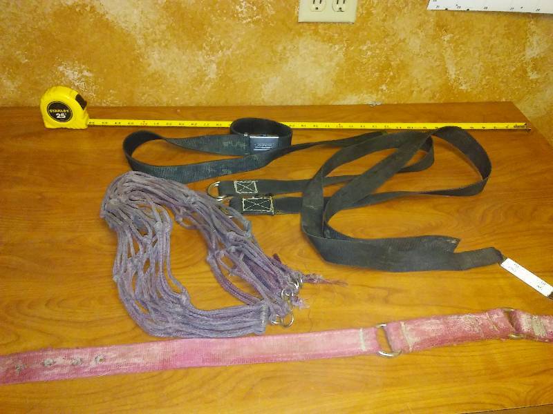 lot 185 image: Cloth 38-inch cinch strap, 4 ft. cloth straps (3) and hay bale feeder net