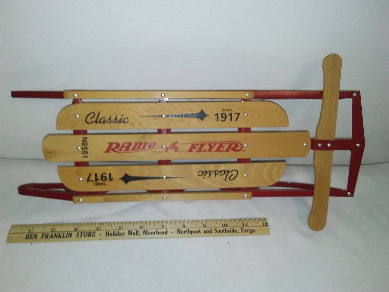 lot 12 image: Radio Flyer Wood and Metal Sled, over 16 inches long