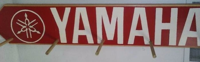 lot 17 image: Yamaha Wall Coat Rack, 4 ft. L x 9.25 H, 5 dowels (dowels are removeable shipping)