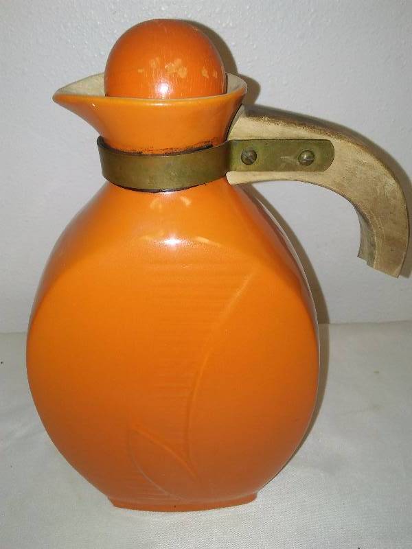 lot 26 image: Red Wing Jug with Cover, Wood Handle (handle is missing a piece), Orange