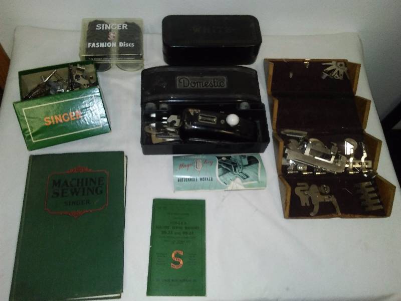 lot 44 image: Vintage Singer Sewing Machine Books (2) and Misc. Vintage Attachments