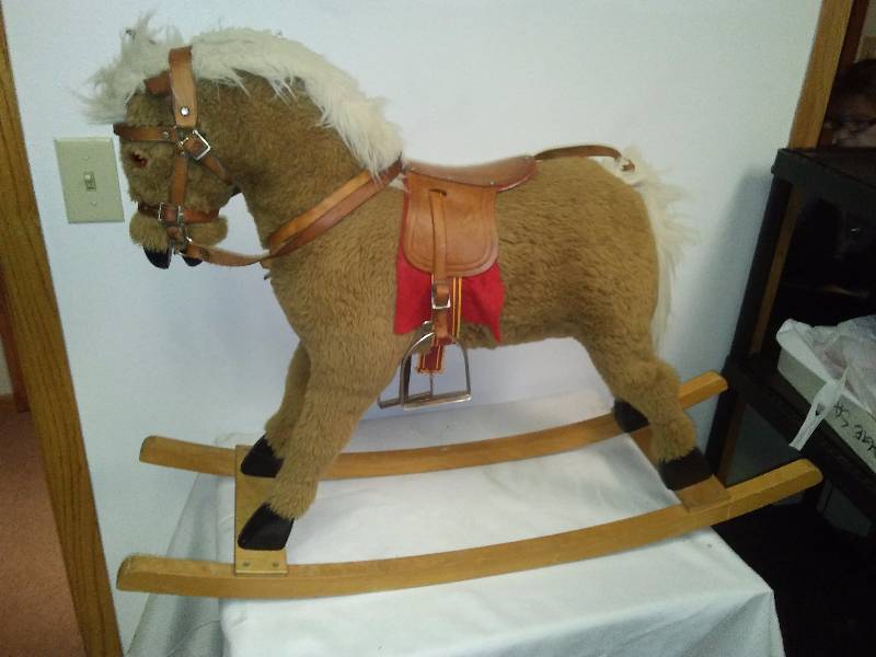lot 62 image: Childs Rocking Horse, Leather accents and metal stirrups