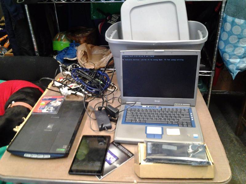 Dell Lap Top With New Battery, Netgear Tablet (Both Have Operational Problems) & Cannon Scanner Other Cords & Tote With Lid