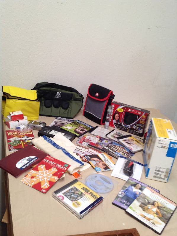 lot 63 image: Dog training dvd, Fitness dvds, Computer software, cd writer, lunch bags