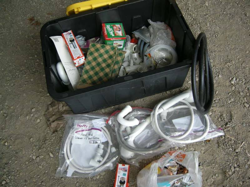 lot 91 image: Large Tote Plumbing Supplies