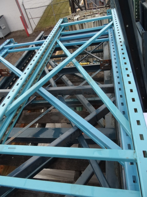 metal shelving unit. 2 uprights. 12...