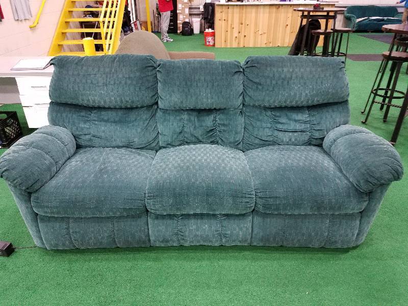 Reclining heated massaging couch