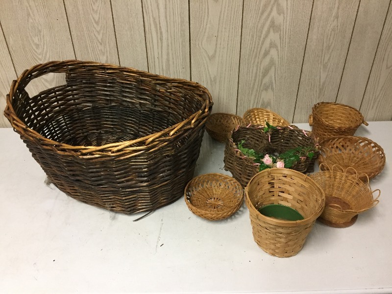 lot 41 image: Wicker Laundry Basket full of smaller baskets