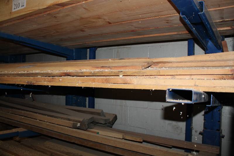 lot 211 image: Sixth shelf down wood south wall in bay