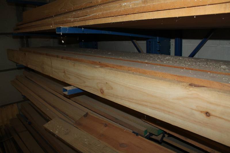 lot 210 image: Fifth shelf down wood south wall in bay