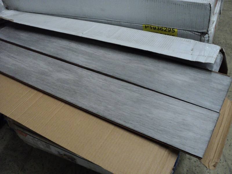 4 boxes of grey flooring 20 planks ...