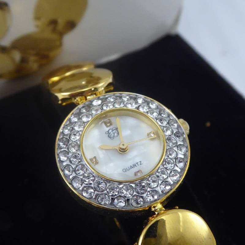lot 77 image: White Diamonds Elizabeth Taylor Crystal Bezel Watch
