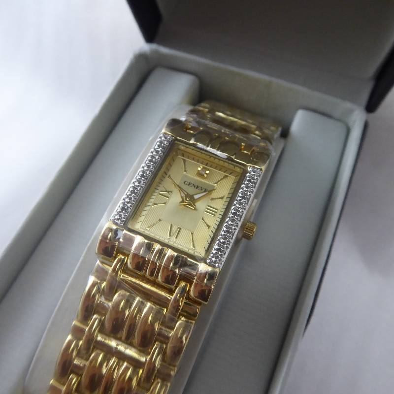 lot 100 image: Geneve Womens .05 Carat Gold Tone Diamond Watch