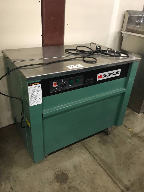 BOX STRAPPING MACHINE