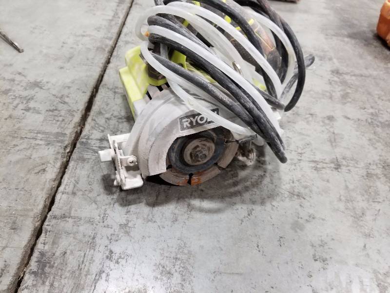 lot 19 image: Ryobi 4in. WetDry Masonary Saw