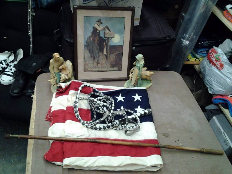 lot 18 image: Western Picture Cream Of Wheat, 2-Figurines, Gun Cleaning Rod, Leather Whip, 3x5 American Flag