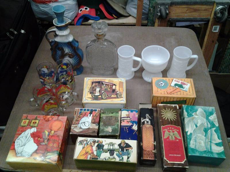 lot 24 image: Collection Of Avon Bottles, Jim Beams Decanters, Milk Glass & Cartoon Glasses