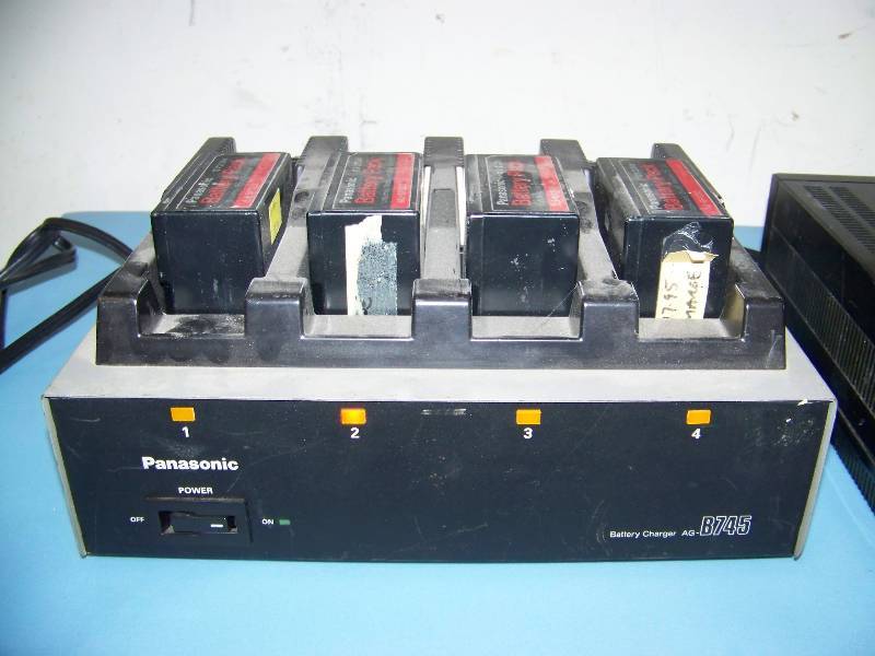 lot 49 image: Panasonic, AC Adaptor, Battery Charger, Portable Video Cassette Recorder and Hitachi, Video Camera with View FInder