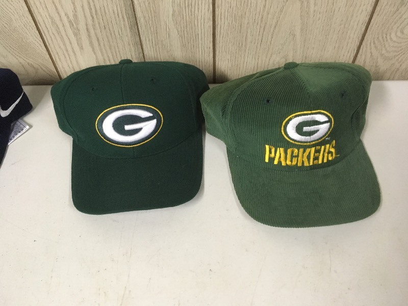 lot 13 image: Packers Cowboys Cubs Gear - Hats Shorts