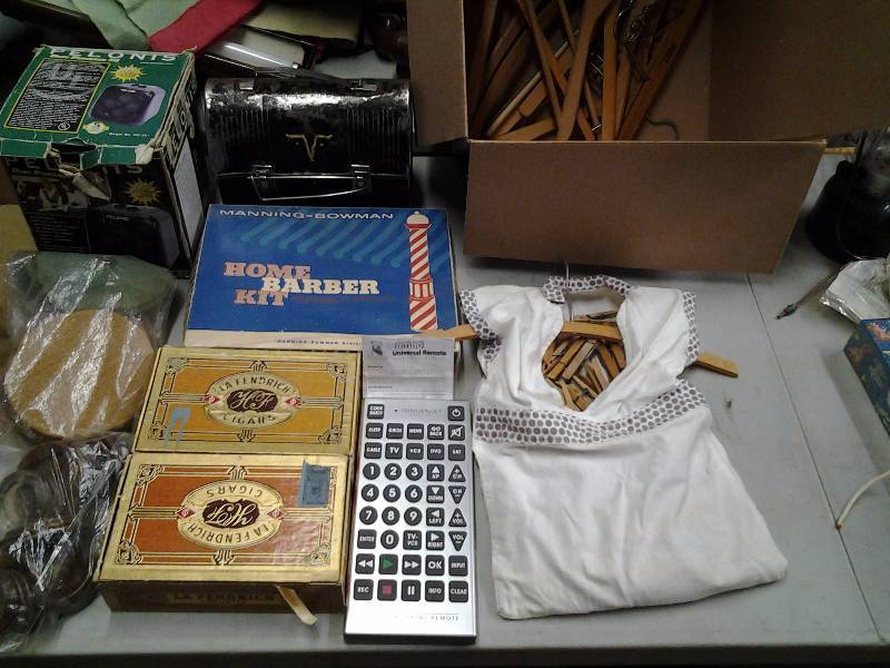 lot 26 image: Pelonis Heater, Jumbo Remote With Manual, Home Barber Kit, Clothes Pins & Hangers, Lunchbox With Thermos, Cigar Boxes, Misc.