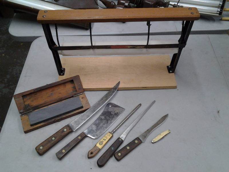 lot 48 image: Assorted Knives, Cleaver, Sharpening Stone, & Paper Dispenser