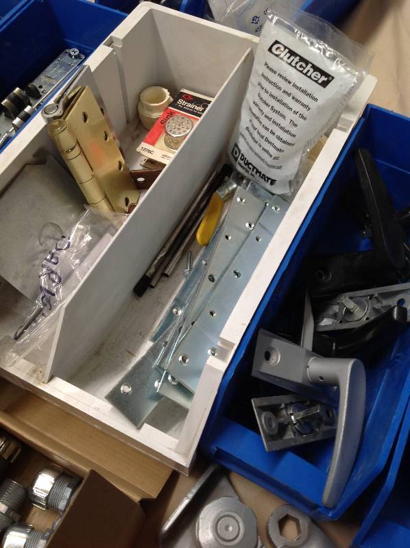 Commercial Door hardware, hinges, push handles, brackets and more with bins.