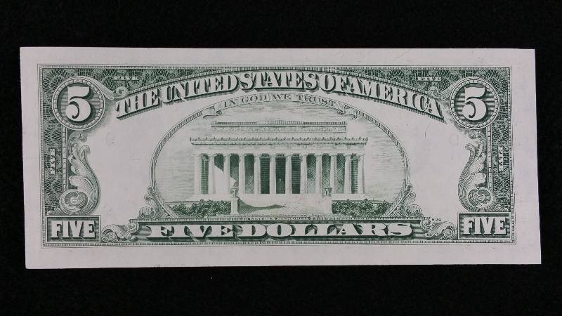 lot 26 image: 1981 $5 Error Note - Miscut Obverse