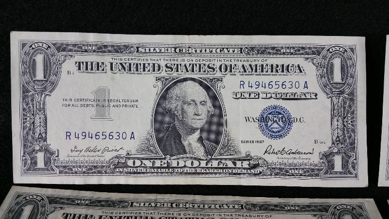 lot 43 image: (6) 1957 Plain, A, & B $1 Blue Seal Silver Certificates