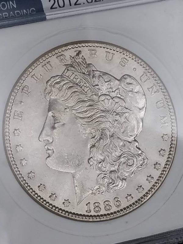 lot 52 image: 1886 P Morgan Silver Dollar - MS65