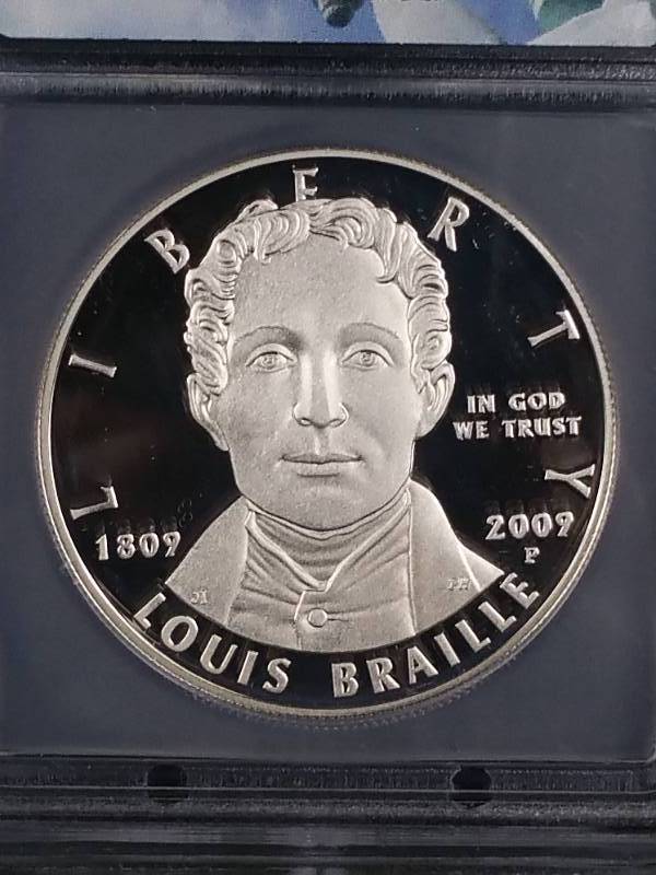 lot 65 image: 2009 P Louis Braille $1 Silver Dollar - PR70 DCAM
