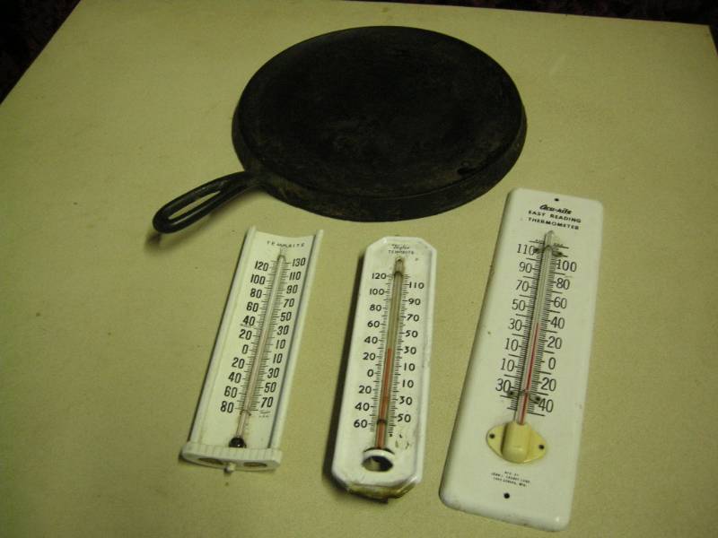 lot 26 image: Vintage Wagner Cast Iron and Thermometers