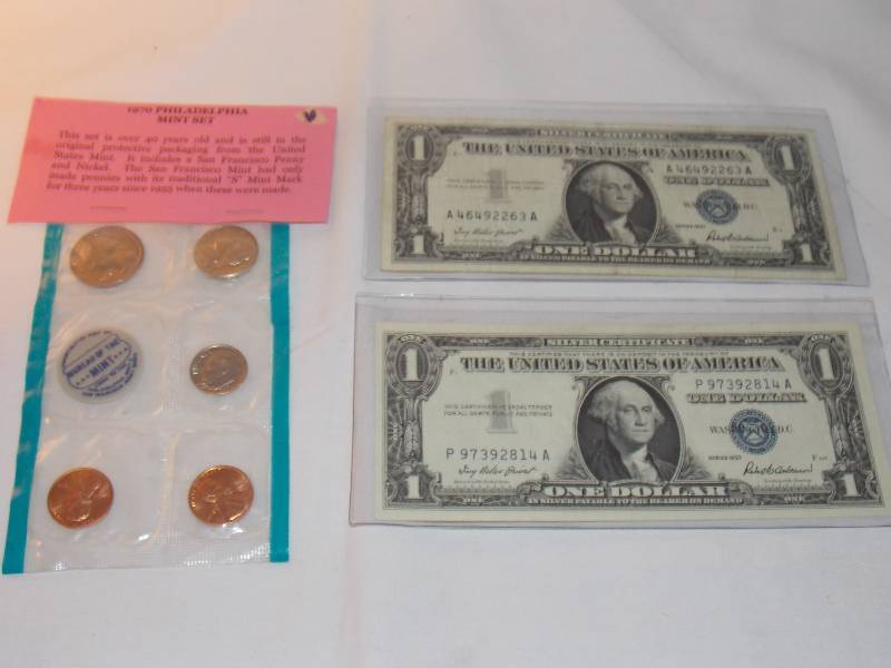 2 1957 Silver Certificates and 1970 Philadelphia Mint Set one Silver Certificates looks like its in really good shape don�t see any folds in it
