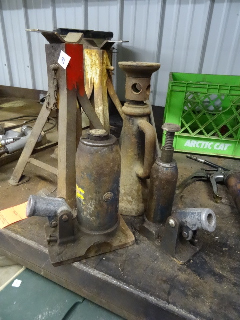 lot 92 image: 3 jack stands. Rail road jack. 2 hy...