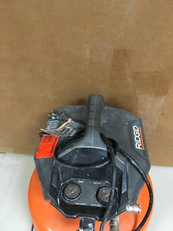 Ridgid 6 Gallon Oil Free Pancake Air Compressor in working conditions