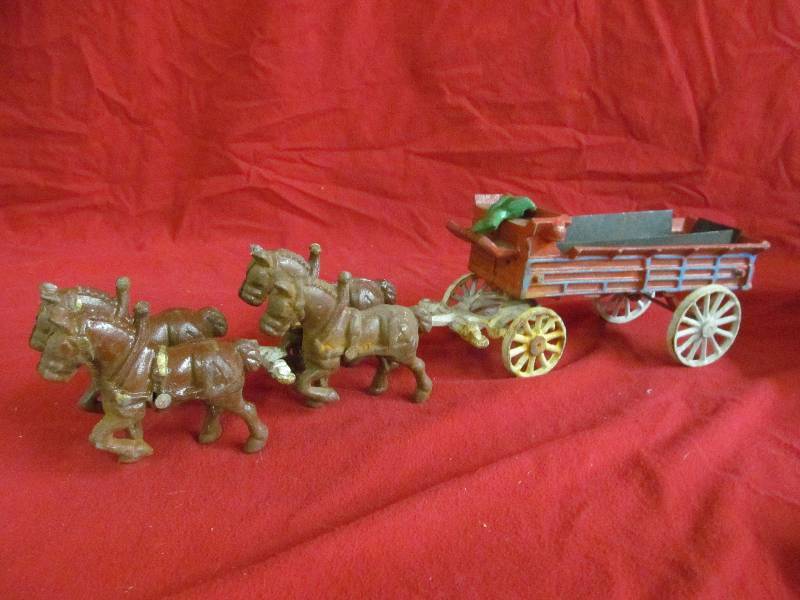 lot 12 image: vintage cast iron horse drawn wagon