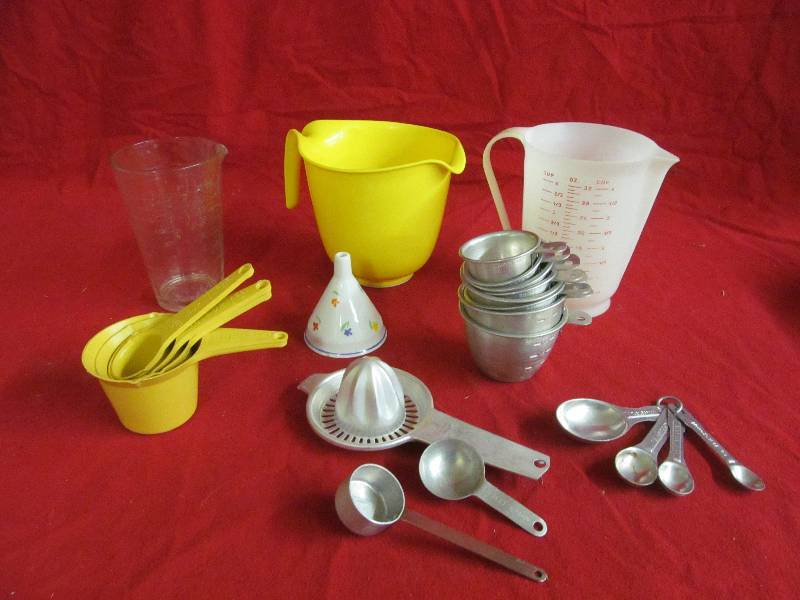 lot 56 image: vintage measuring cups, pitchers, juicer